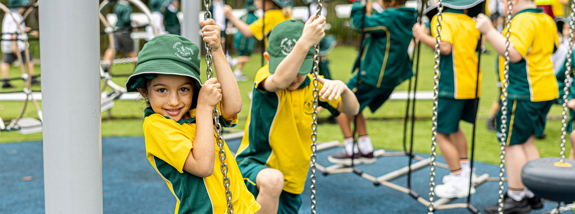 Student on play equipment from Corpus Christi Catholic Primary School Cranebrook