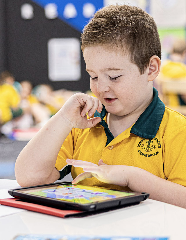 Student on iPad at Corpus Christi Catholic Primary School Cranebrook