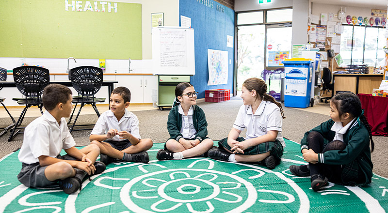Students on rug at Corpus Christi Catholic Primary School Cranebrook