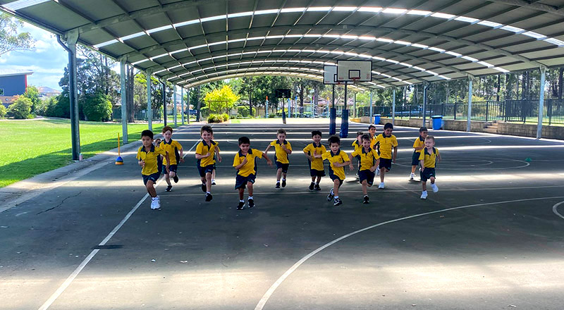 Students running at Corpus Christi Catholic Primary School Cranebrook