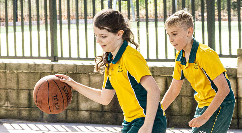 Students playing basketball at Corpus Christi Catholic Primary School Cranebrook