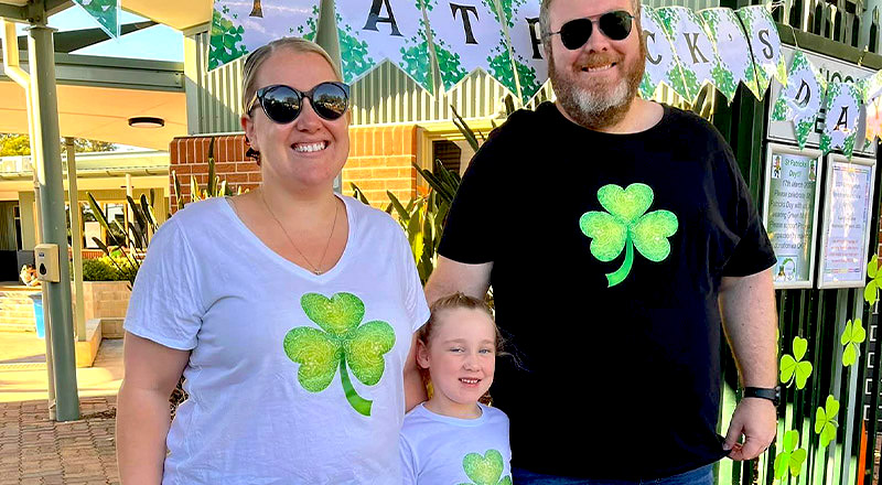 Parents and child celebrate St Patrick's day at Corpus Christi Catholic Primary School Cranebrook