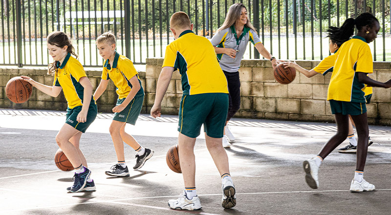 Students playing basketball at Corpus Christi Catholic Primary School Cranebrook