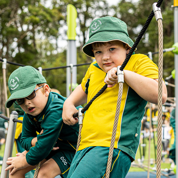 Students on play equipment at Corpus Christi Catholic Primary School Cranebrook
