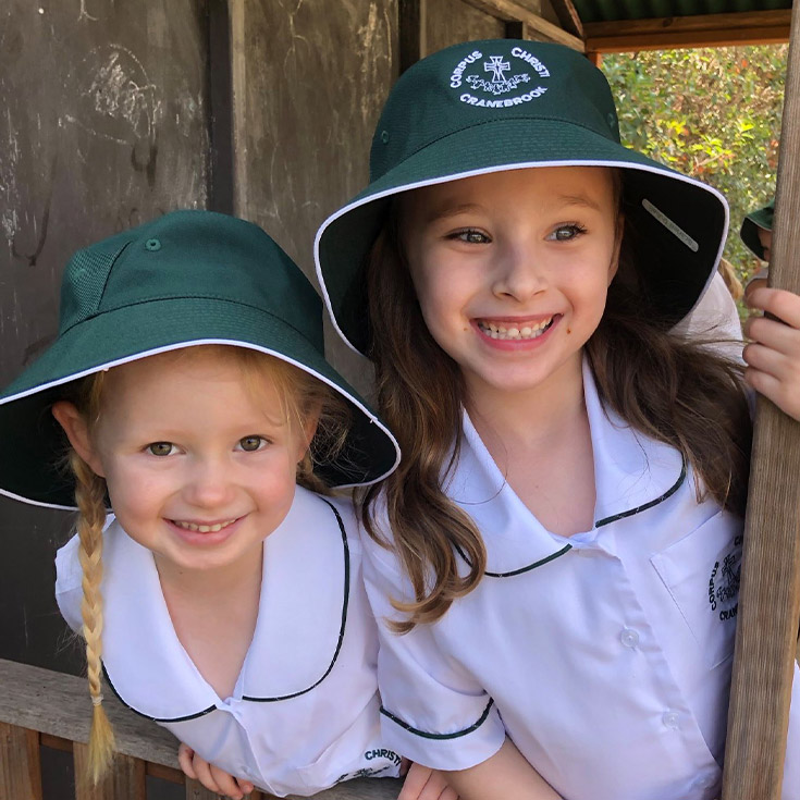 Students playing inside cubby house at Corpus Christi Catholic Primary School Cranebrook