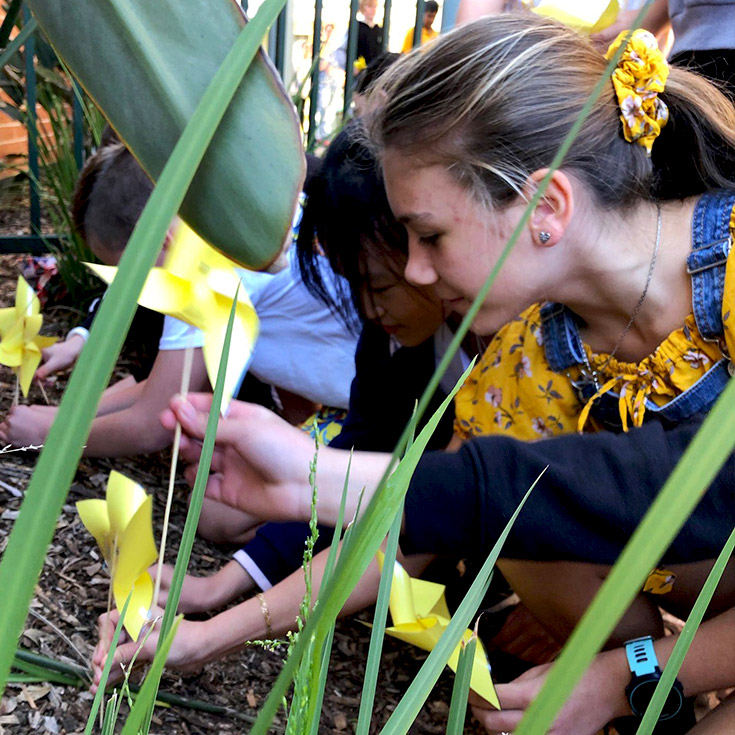 Student in garden at Corpus Christi Catholic Primary School Cranebrook