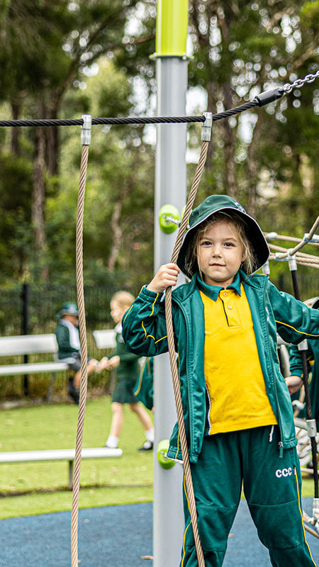 Corpus Christi Cranebrook Primary student playing on outdoor equipment