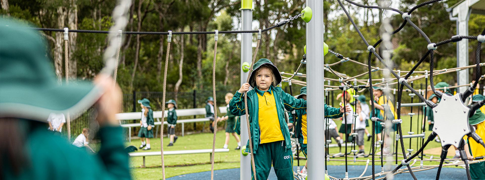 Corpus Christi Cranebrook Primary student playing on outdoor equipment